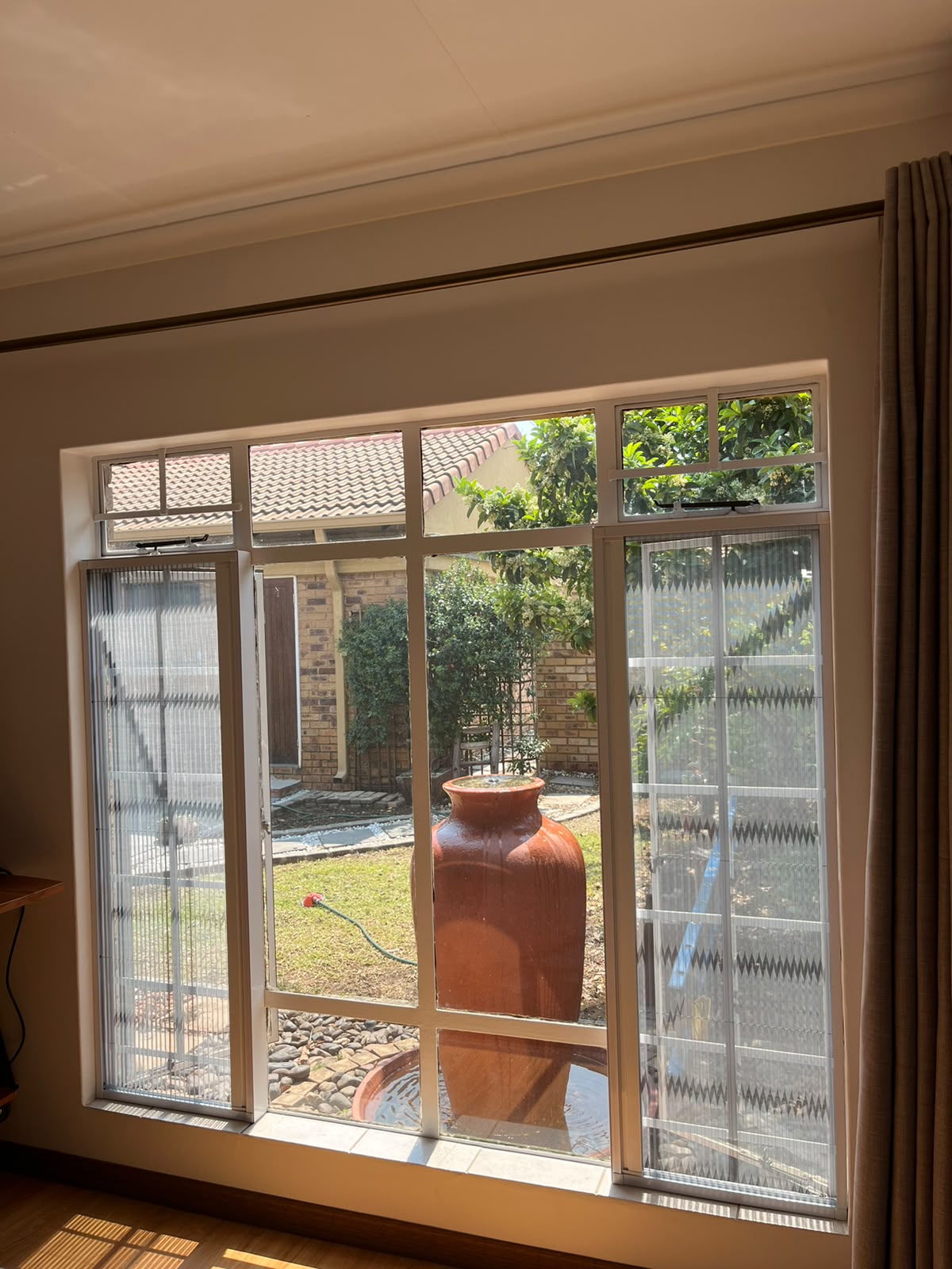 Custom flyscreen fitted to a steel-frame opening 4