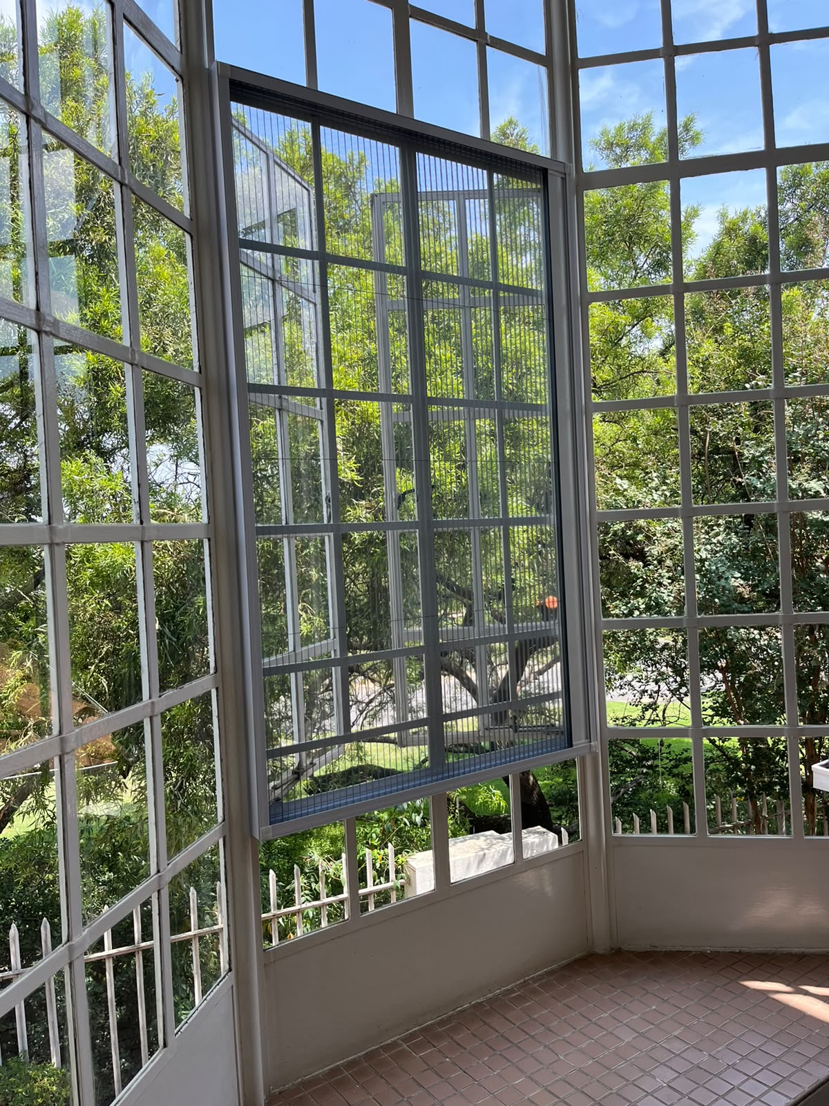 Custom flyscreen fitted to a steel-frame opening 6