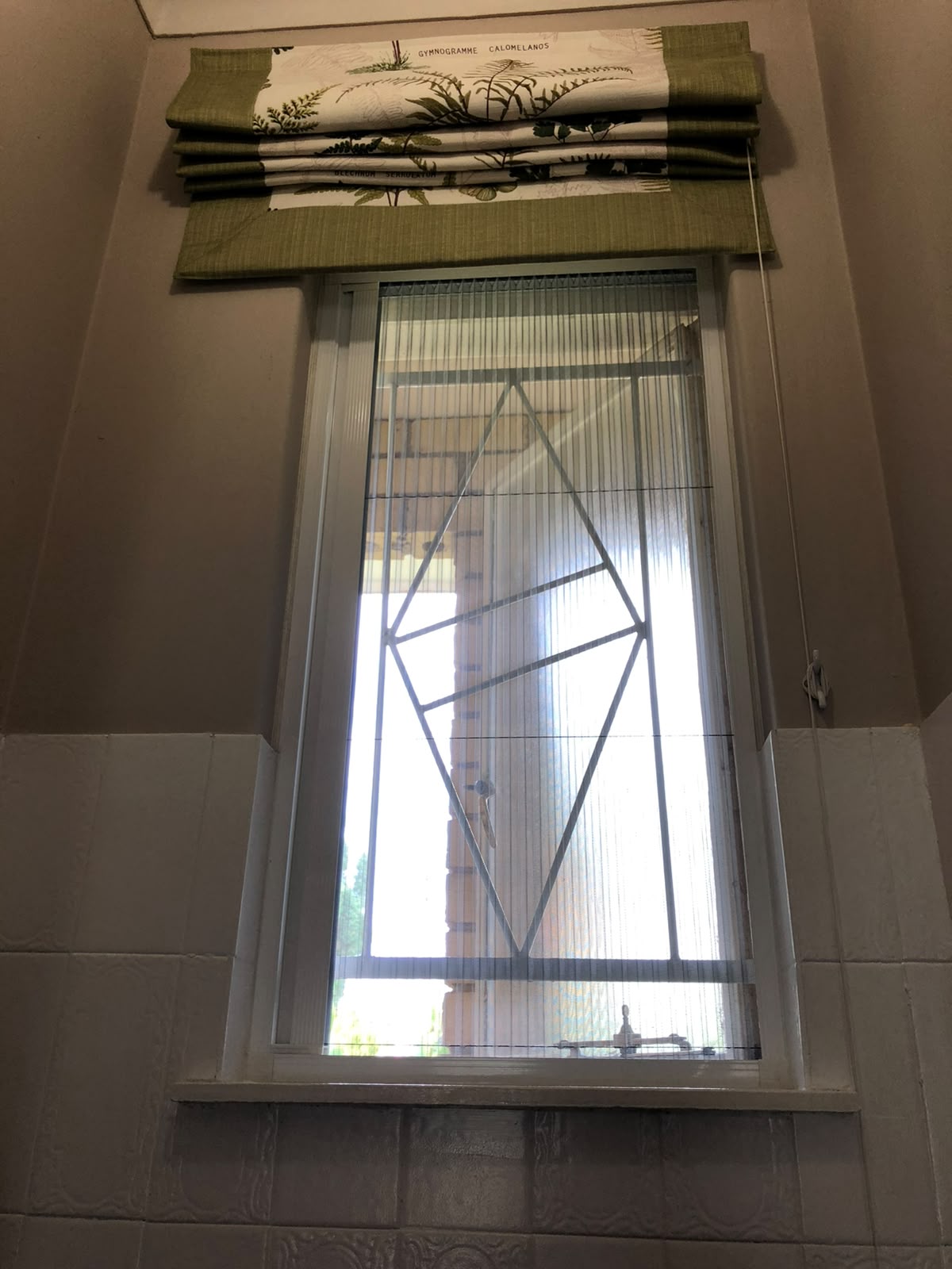 Custom flyscreen fitted to a steel-frame opening 8