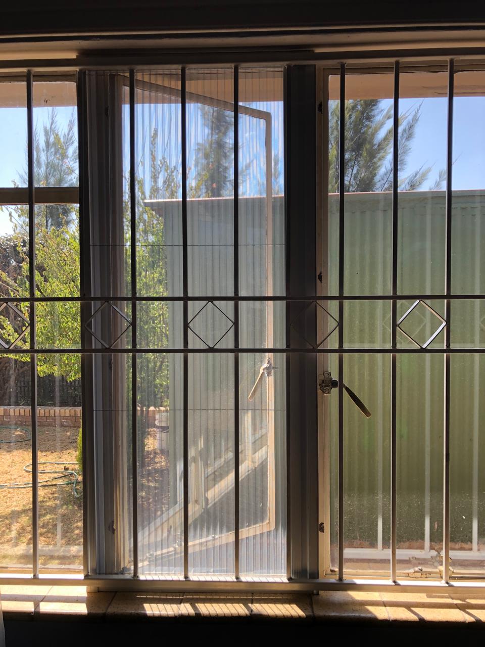Custom flyscreen fitted to a steel-frame opening 10