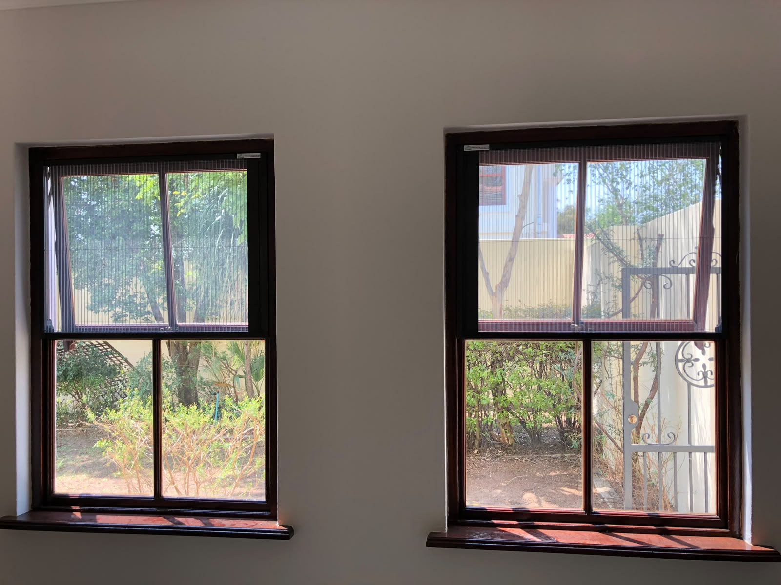 Custom flyscreen fitted to a wooden window 3