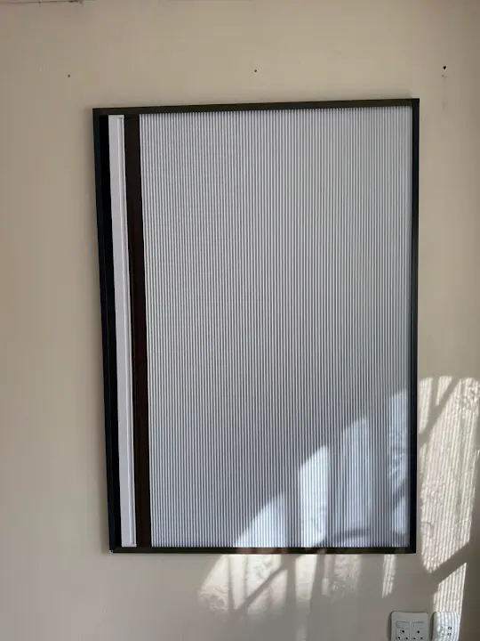White blockout screen fitted neatly to a window
